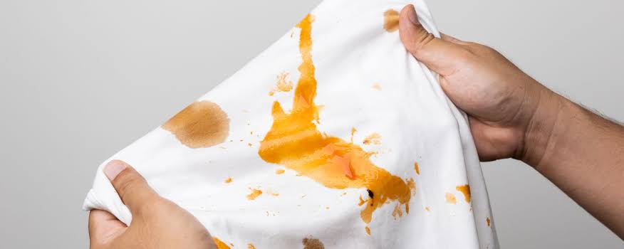 Removing oil and grease stains from clothes